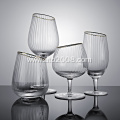 Slanted tumbler glass with gold rim